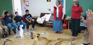 Hul'q'umi'num' Elder Philomena Pagaduan and Parks Canada Interpreter Athena George share stories in the schools about threatened plants and animals