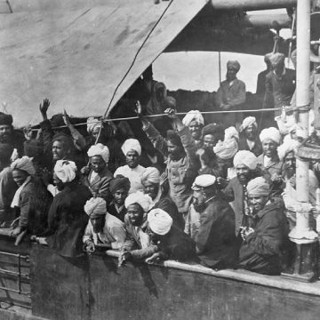 Black and white photo of a group of people on a boat