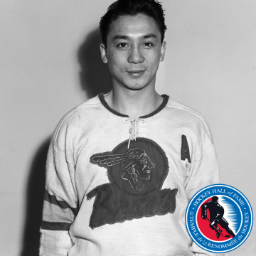 Black and white portrait of a hockey player in jersey