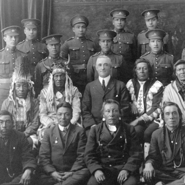 Black and white photo of a group of soldiers posing for the photo