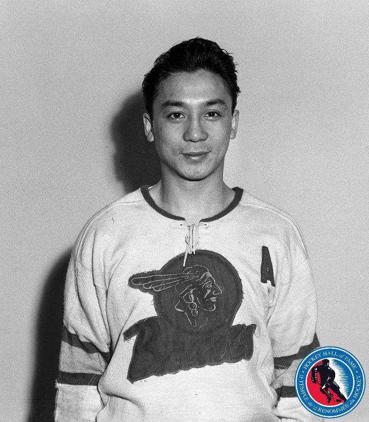 A historic black and white photo of a hockey player