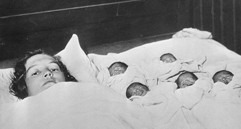 Dionne quintuplets with their mother, 1934.