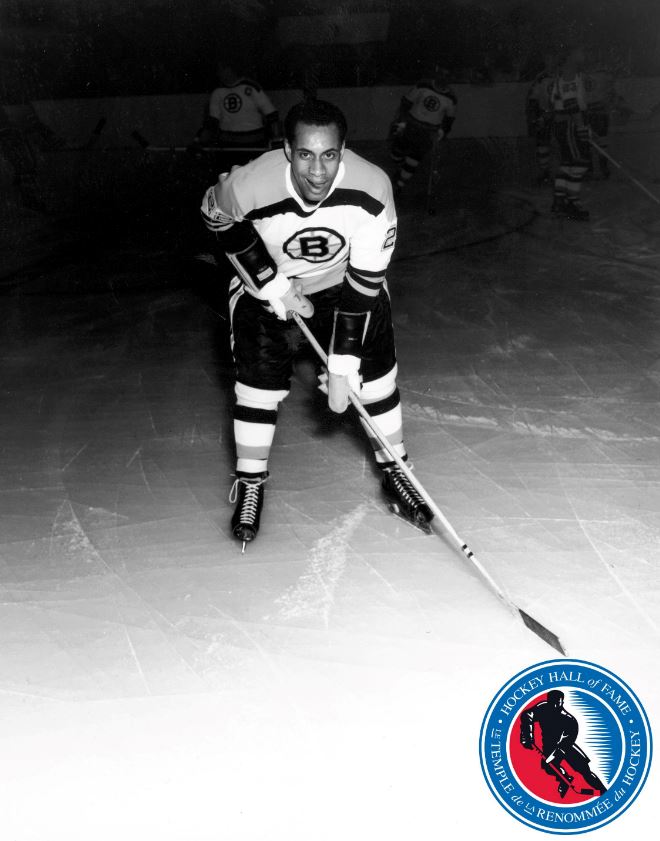 A historic black and white photo of a hockey player
