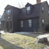 Photo of a large brown coloured house