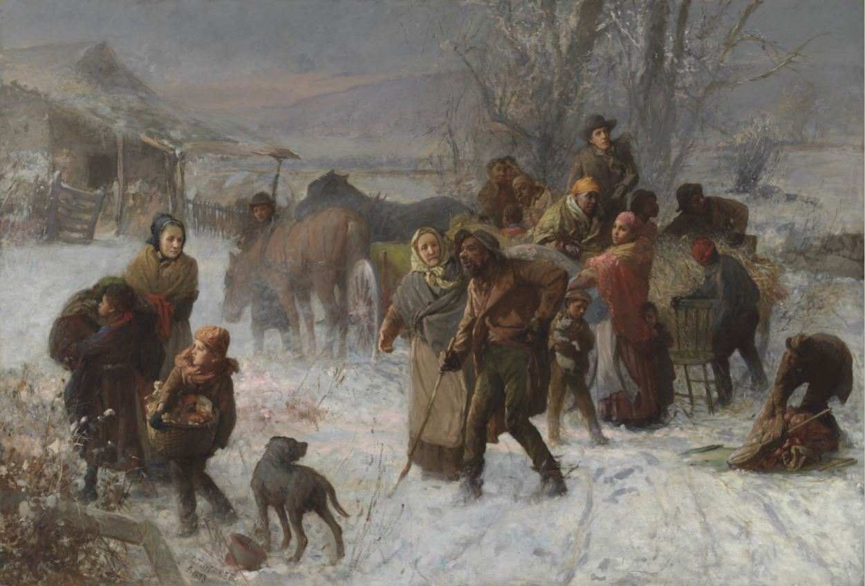 A group of people in a snow covered town