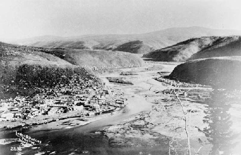 Black and white aerial photo of creeks emptying in a river