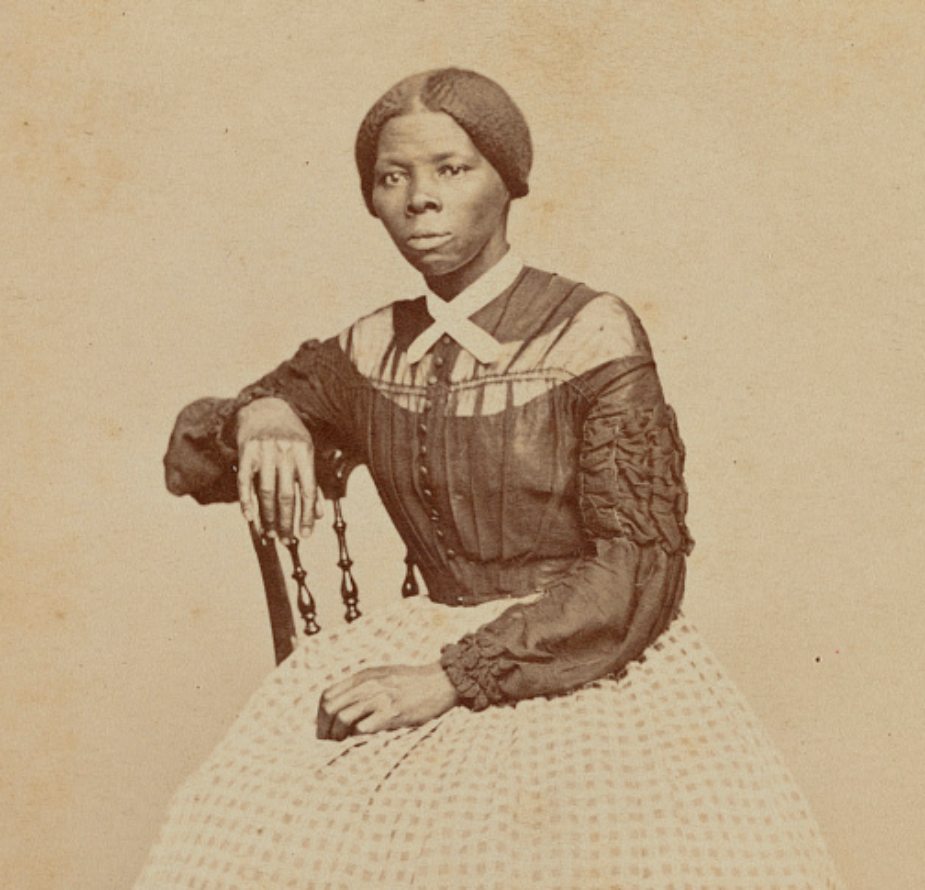 Old sepia image of a woman sitting