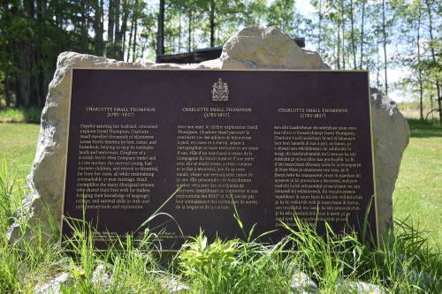 Bronze commemorative plaque on its stand in the grass