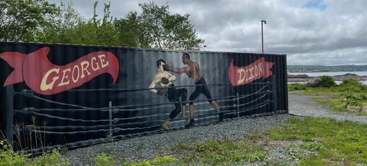 Photo of a mural painted on a container of two boxers