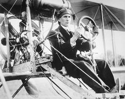 Historical photo of a man in an experimental plane