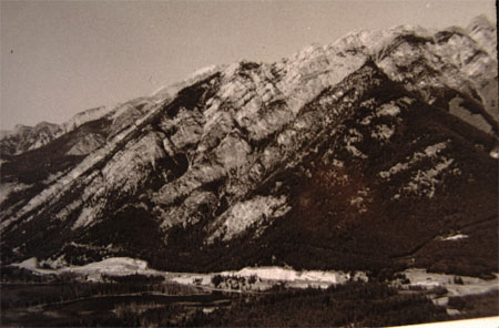 Two photos of Mount Norquay in Banff National Park. One photo was taken in 1902, and the other was taken in 1984. The 1984 photo has significantly vegetation expansion up the slopes of Mount Norquay due to fire suppression.