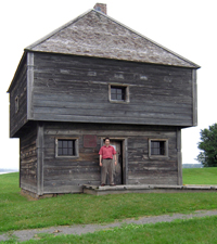 Man standing in front of blockhouse door