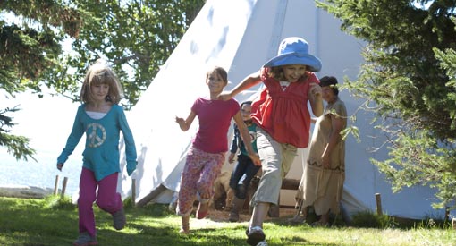 Children playing near the wigwam. 