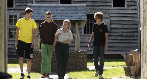 Visitors with an interpreter near the well. 