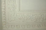 Plaster cornice at the ceiling of the living room.