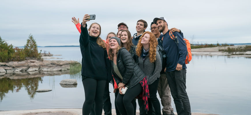 Campus Club Leaders taking a group selfie on Beausoleil Island.