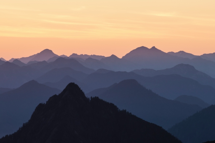 A vast mountain range at sunset. 