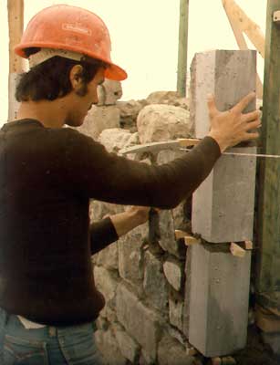 Mason rebuilding a stone wall of the forteress.