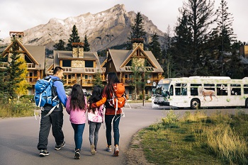 A family walking toward a bus 