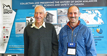 Peter Schaerer and Jeff Goodrich stand in front of “Land of Thudering Snow” exhibit. 