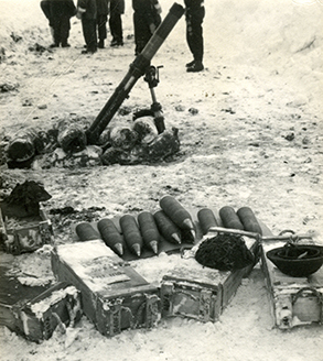 Mortar, with ammunition laid in front. 
