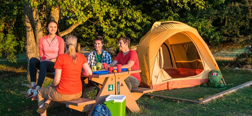  Group of friends relax by their tent