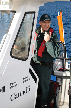 Park Warden patroling on a boat