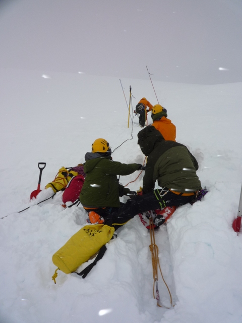 Parks Canada Rescue Team prepares to lower a member into the crevasse