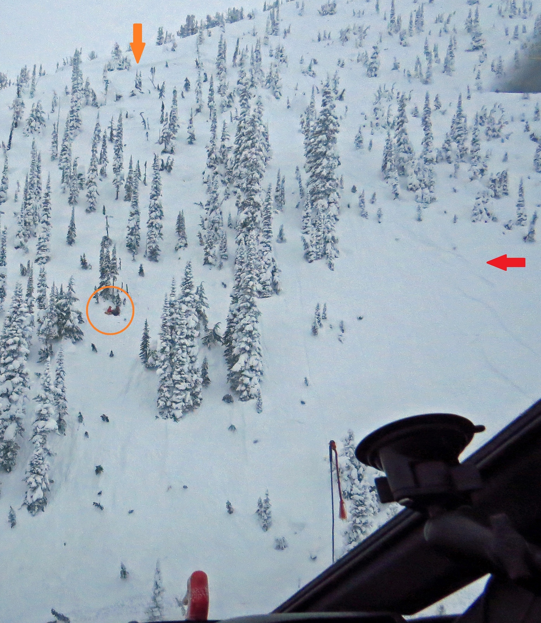 Photo of avalanche showing fracture line, ski tracks and skier location