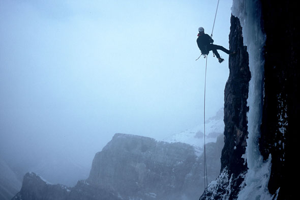 A mixed climber swings for the ice in Yoho National Park