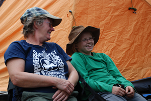 A Girl Guide and Leader share a laugh at their campsite in Nahanni National Park Reserve of Canada.
