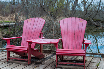 Red chairs on boardwalk