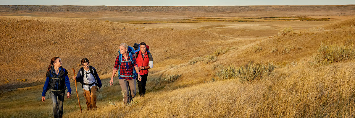 A park interpreter leads a group of visitors on a hike in the West Block of Grasslands National Park.