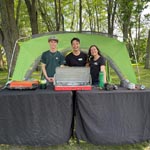 John, Kevin and Luisa showing off different campstove models.