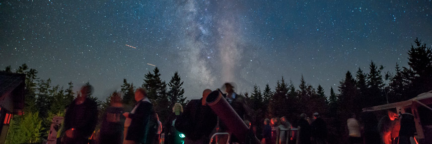 Stargazers admire the Milky Way at a gathering.