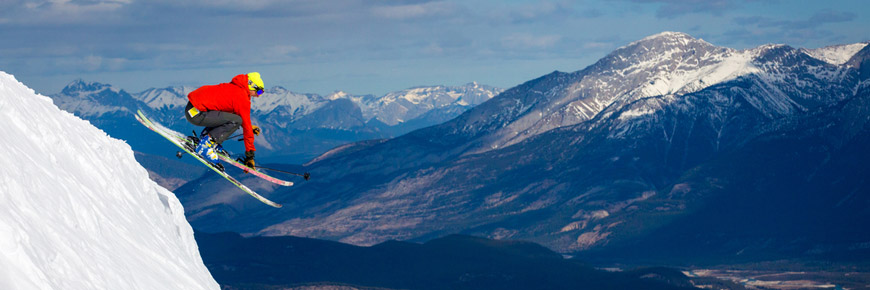 A young man downhill skies at Marmot Basin.