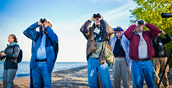 A group of birdwatchers at Point Pelee National Park of Canada.