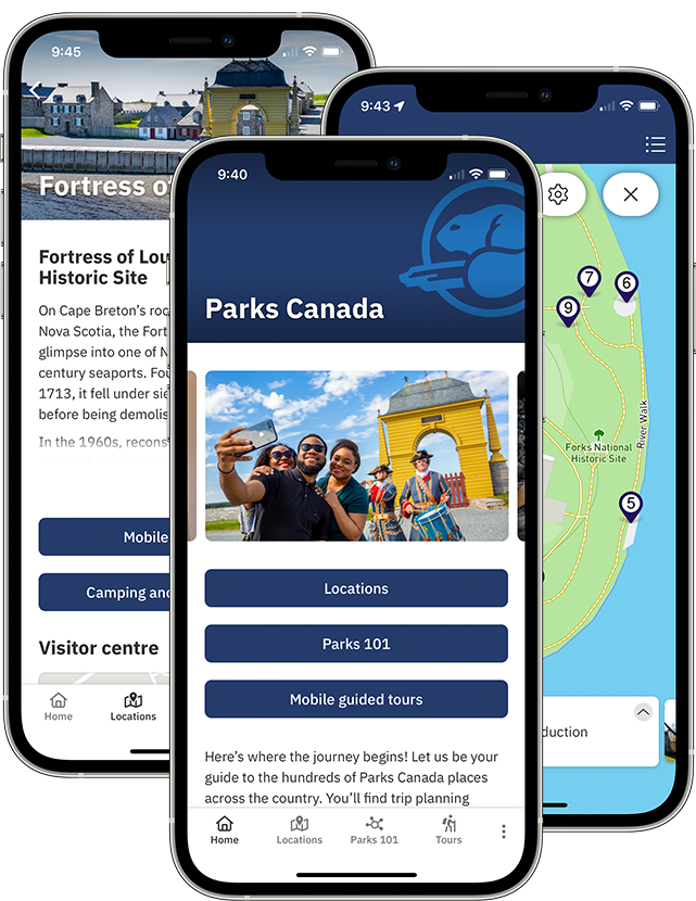 Three cell phones with the Parks Canada App displayed on their screens. The first screen shows navigation buttons and a bright photo, the second one shows a map with location pins, the third one shows a screen filled with text.