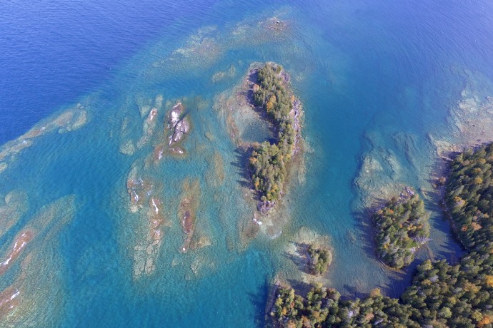 An aerial view of coastal forested islands. 